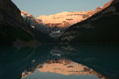 20 First Rays Of Sunrise Burn Mount Victoria Yellow Orange Reflected In The Still Waters Of Lake Louise.jpg